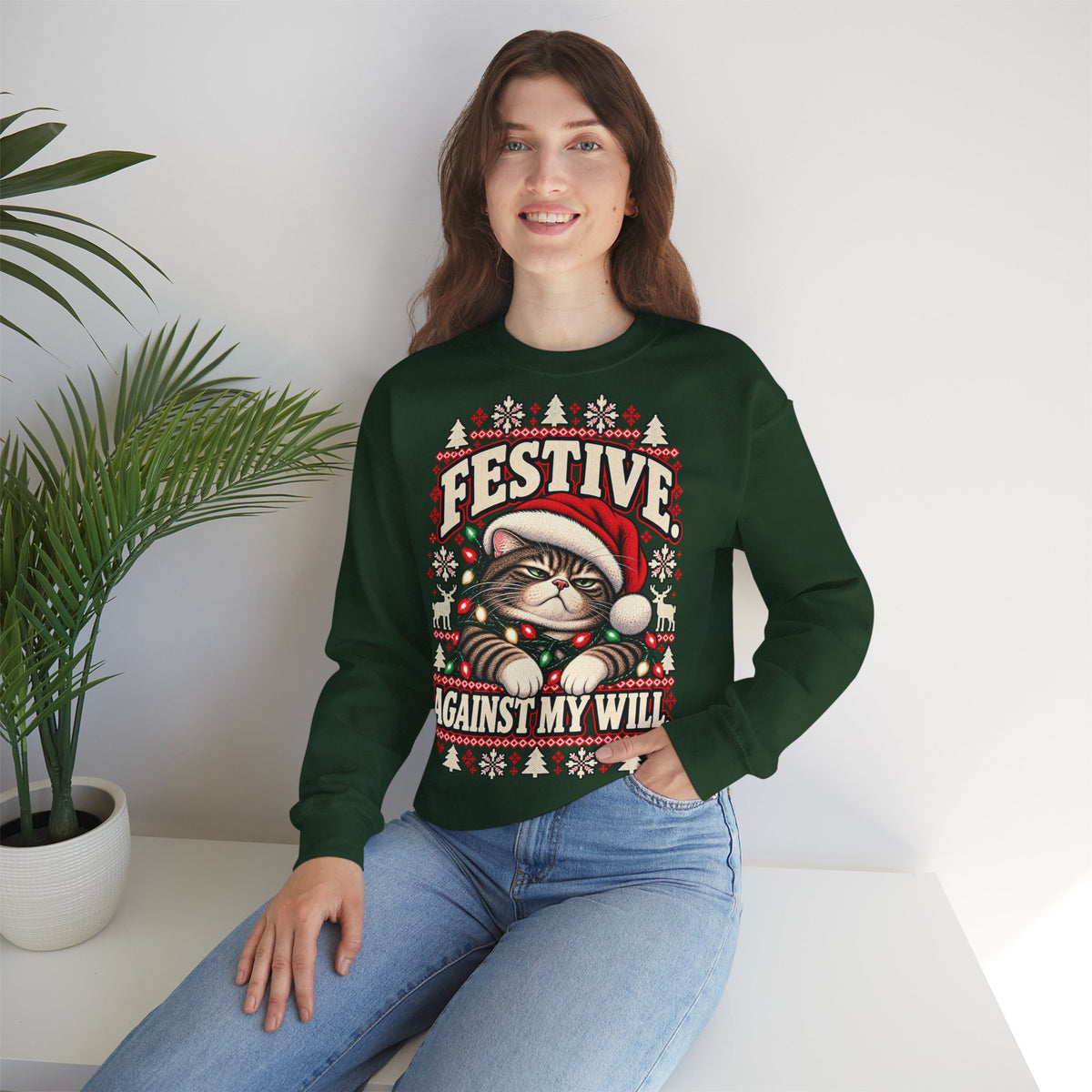 Woman wearing a forest green grumpy cat Christmas sweatshirt in a casual holiday outfit