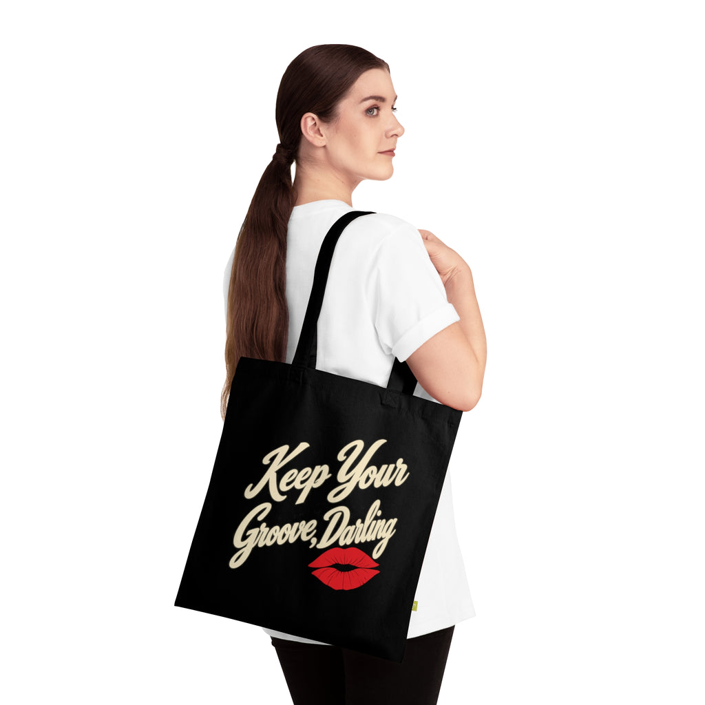 Woman wearing Keep Your Groove Darling retro tote bag