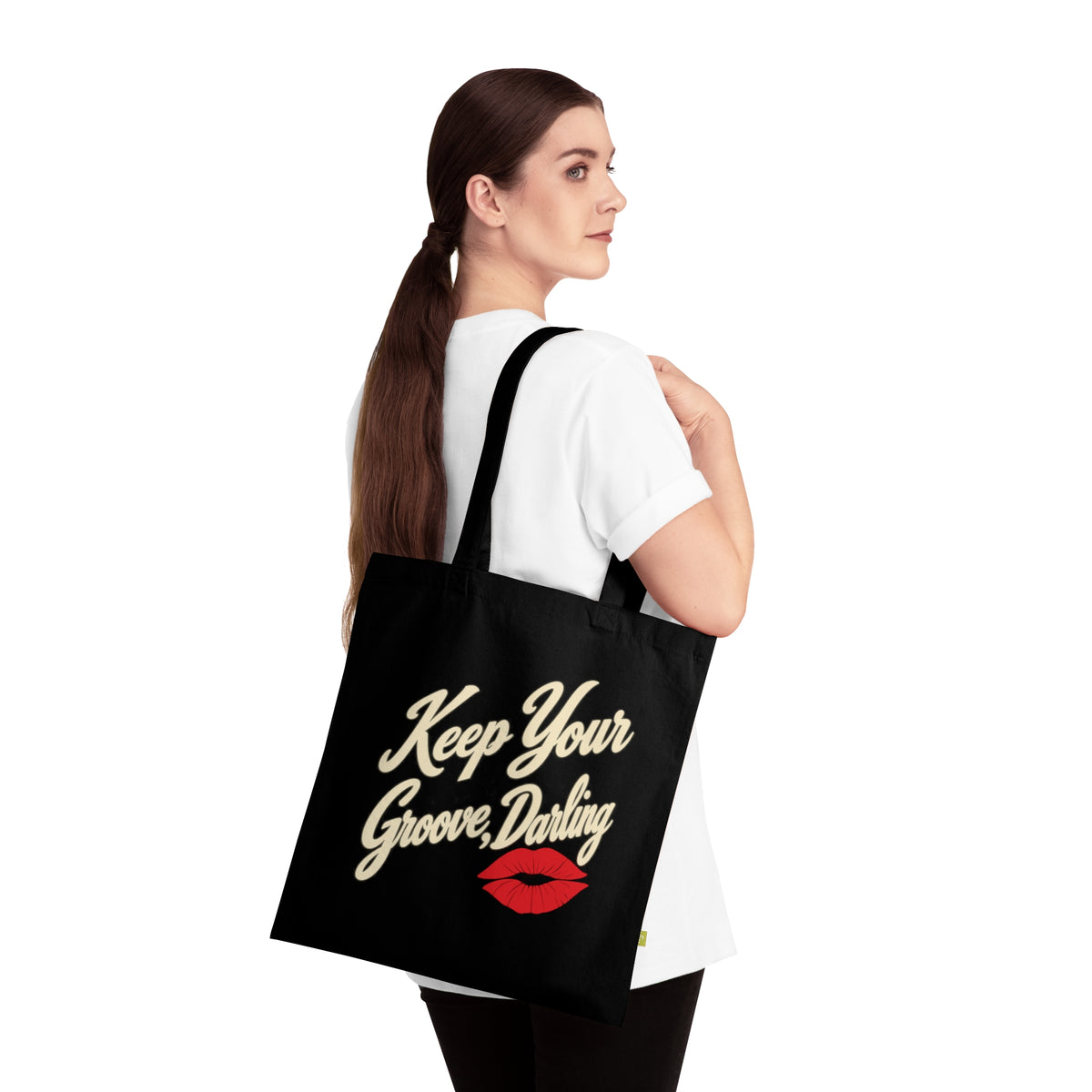 Woman wearing Keep Your Groove Darling retro tote bag