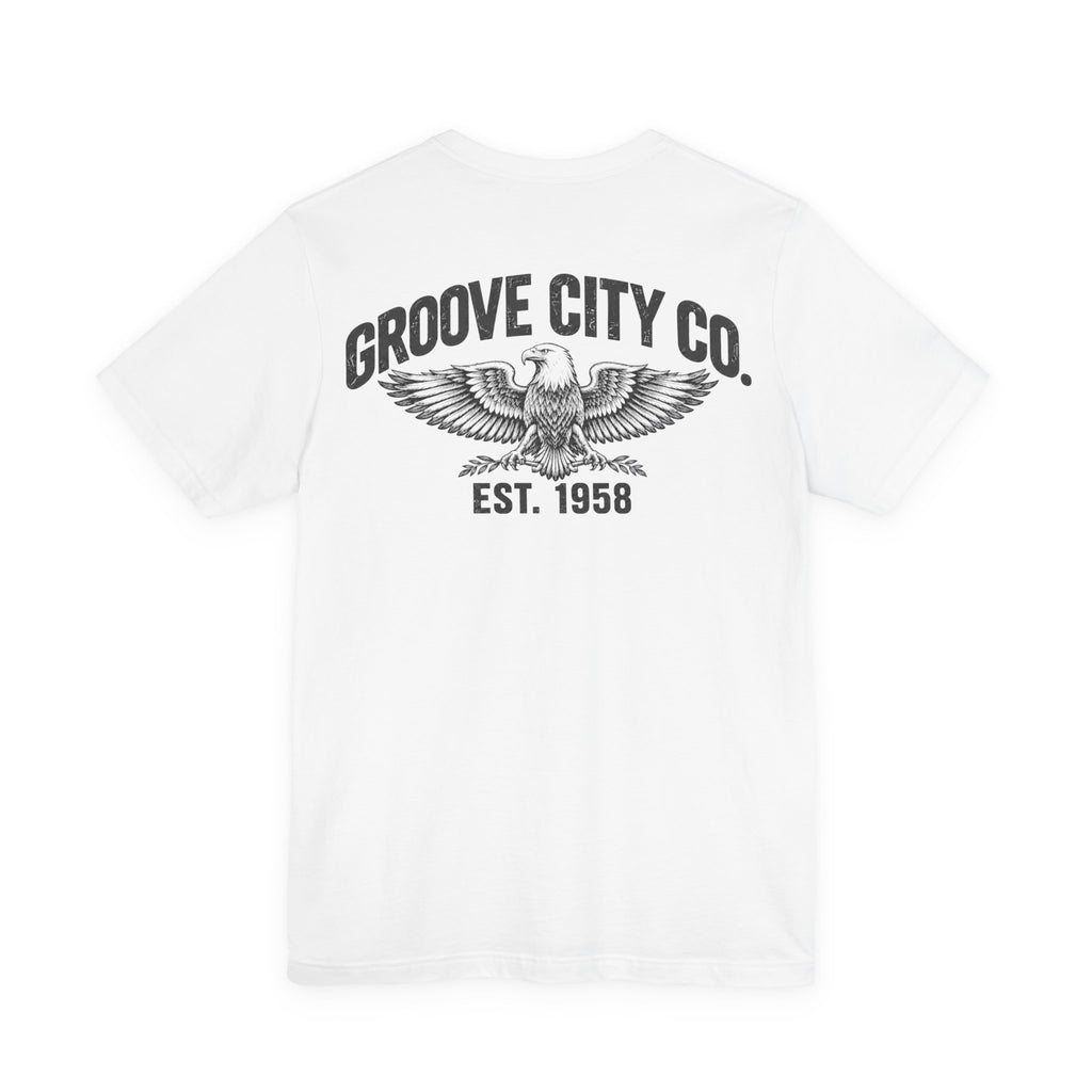 Back view of a white Groove City Co. vintage graphic T-shirt featuring a distressed eagle design, retro lettering and Est. 1958 print.